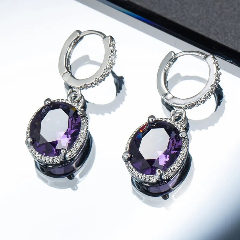 Purple red zircon round earrings