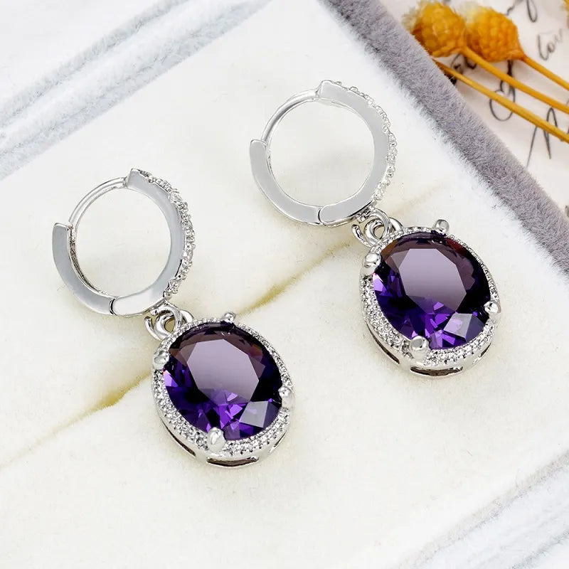 Purple red zircon round earrings